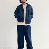 INDIGO DYED RELAXED PLEATED TROUSERS